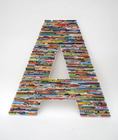 a large letter made out of books on a white background with the letters'a'in it