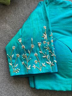 Product Descriptions : Blue silk blouse comes with intricate hand work for sleeves as shown View this post on Instagram A post shared by Handcrafted Sarees by Shobana Nithin (@threadslabel_india) Re Work Blouse, Blouse Aari Work Simple, Simple Work On Blouse Designs, Spring Work Blouse Designs, Blouse Sleeve Hand Work Design, Back Neck Work Designs For Blouses, Blouses Embroidery Designs, Blouse Thread Embroidery Designs, Best Maggam Work Blouse Designs