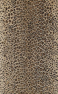 an animal print rug with black and brown spots