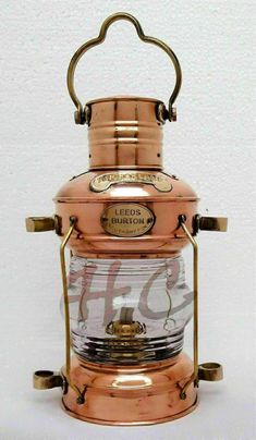 an old fashioned copper lantern on a white background