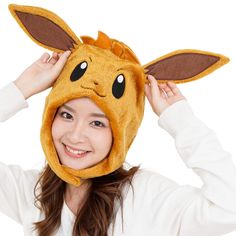 PRICES MAY VARY. Officially licensed Pokémon Eevee Kigurumi Hat produced by the original Japanese brand SAZAC: Don’t fall for copycat imitations! SAZAC is Japan’s most successful Kigurumi manufacturer, unmatched in both quality and design. Our onesies feature symmetrical faces, professional stitching, thicker fabric and rich, vibrant colors. Warm your head with Eevee: This cute fluffy hat is specifically designed with ear flaps to warm your ears and they can be together under the chin to make a Types Of Beanies, Pokemon Beanie, Pokémon Eevee, Pokemon Jewelry, Character Dress Up, Pokemon Costumes, Pokemon Sketch, Dress Up Day, Hat Types