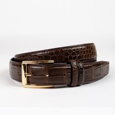 Our Chocolate Brown Genuine Crocodile Skin Belt Is A Must-Have In Any Wardrobe. Timeless And Versatile, This Belt Will Effortlessly Compliment Almost Any Outfit. Perfect For Day Or Night, This Is One Of Those Accessories That Will Carry You From Season To Season. Features: Genuine Crocodile Skin Hidden Snaps For Interchangeable Buckle Pebbled Calf Skin Lining Crocodile Belt, Tan Leather Belt, Skin Line, Brown Cowhide, Brass Belt Buckles, Vintage Belt Buckles, Crocodile Skin, Leather Belts Men, Western Belts