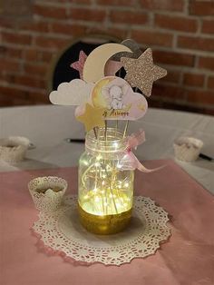 there is a mason jar with some decorations in it