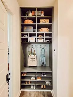 a closet with shoes and bags on shelves next to an open door that leads to another room