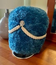 "This is a really cool marching band hat in blue coloring. The material appears to be blue plush cotton. At some point, there may have been feathers attached to the top, but they are missing from this piece. Aside from making a great costume hat, it would make a nice addition to a family room or den for a musical family. The measurements are: 12\" High 10\" Wide 10\" Deep Thanks for checking out my shop. I hope you enjoy this, and the many other great vintage goods I have. All my items are actual vintage, I never sell reproductions. Please review the description and all photos so you're aware of the condition of this item. I've tried my best to accurately represent it in the description and photos, but please feel free to reach out with any questions." Adjustable Blue Bonnet Cap, Adjustable Blue Bonnet, Blue Adjustable Costume Hats With Short Brim, Adjustable Blue Costume Hats With Curved Brim, Adjustable Blue Cloche Cap, Adjustable Blue Cap Costume Hats And Headpieces, Blue Adjustable Cap-style Costume Hats, Adjustable Blue Beanie Hat, Blue Festival Cap Hat