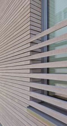 the side of a building with wooden slats on it