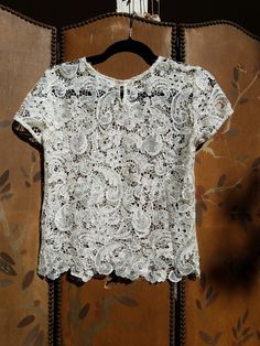 "Pretty ivory lace sheer blouse Bisou bisou  XS Polyester  Bust across 34 Length 22\" Sleeves 6\" Across shoulders 15\"" Fitted Short Sleeve Top With Delicate Lace, Fitted Tops With Delicate Lace And Short Sleeves, Delicate Lace Short Sleeve Top For Summer, Short Sleeve Delicate Lace Tops For Summer, Delicate Lace Short Sleeve Summer Tops, Summer Lace Patchwork Short Sleeve Top, Summer Fitted Blouse With Scalloped Lace, White Short Sleeve Lace Top With Scalloped Lace, White Scalloped Lace Short Sleeve Top