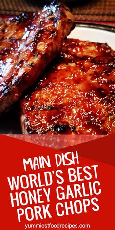 grilled pork chops on a plate with text overlay that reads main dish world's best honey garlic pork chops