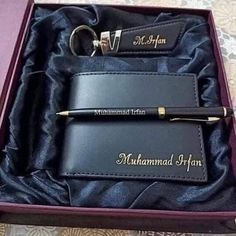 a personalized leather wallet and pen in a gift box