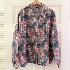 "Long sleeve button up top with floral and paisley pattern. Fits 2X Modeled on size XS/S, 5'6\" Bust 48\" Length 27.5\" Condition: Good Details: Brand on label - Cape Cod Sportswear Size on label - 20 100% polyester Made in USA This is a vintage item and may show signs of wear. Please check the item description/condition for any noticeable flaws that may be listed." 90s Floral, Collared Top, Vintage Clothes Women, Collar Top, Paisley Pattern, Paisley Print, Vintage Tops, Vintage Clothing, Womens Clothing Tops