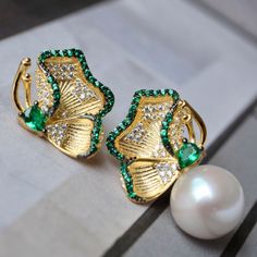 💚💚 Specifics: Materials: Natural freshwater Pearl With 925 Silver And Zircon Earrings Size: 12mm*22mm Pearl Diameter: 10mm*10mm Closure: the closure is made of 925 sterling silver.  Handmade Artwork, original design and copyright protected  Metal: Gold plated s925 silver 💚💚Shipping We ship it in 5-7 days after the payment is made and you may choose your personalized shipping services. We shipping world wide and it is free international shipping. Please kindly be reminded that we are not resp Green Pearl Earrings As Gift, Green Pearl Earrings For Gift, Fine Jewelry Green Pearl Earrings For Gift, Green Pearl Earrings For Wedding, Green Pearl Drop Earrings For Anniversary, Elegant Green Pearl Earrings For Pierced Ears, Green Pearl Earrings For Anniversary, Elegant Green Pearl Earrings Gift, Pearl Studs Earrings