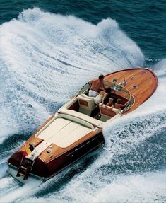 two people on a motor boat in the water