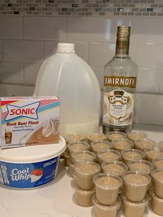 the ingredients to make an ice cream dessert are displayed on a counter top next to a bottle of soda