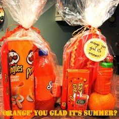 two orange juice bottles wrapped in plastic bags, with the words orange you glad it's summer written on them