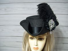 "Perfect for many events from Halloween, Pirate to Victorian Parties this is a Black Faux straw tricorn hat with black trim, black ostrich feathers, black cocarde with jewel center. The turn up on the brim is about 3\". Very pretty hat. This hat is 22.5\" for the inside circumference and also has a built-in tie hat sizer. Please measure your head as I cannot make this hat larger for the inside circumference. All Sales are final. Please visit my shop for more hats and pins. I ship Priority mail. I ship many times a week. If you need your item quicker let me know your zip code and I can figure shipping rates for you. Please let me know if you have any questions. All sales are FINAL, no returns or exchanges please keep this in mind before purchasing." Black Pirate Costume Hat With Curved Brim, Black Costume Accessories With Curved Brim For Costume Party, Vintage Black Fascinator For Costume Party, Fitted Black Hat For Carnival, Vintage Black Costume Accessories For Themed Events, Black Costume Top Hat With Short Brim, Black Top Hat With Short Brim For Costume, Black Brimmed Hat For Themed Events, Black Brimmed Top Hat For Costume