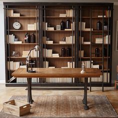 a large bookcase in the middle of a living room filled with books and furniture