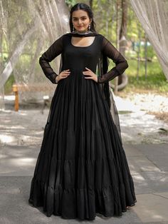 This enchanting black georgette reception wearing a plain gown with a dupatta is a stunning piece that will make you stand out at any event. Made from high-quality georgette material, this gown is designed to make you feel elegant and confident. The similar color georgette dupatta features rich sequins embroidered work and designer lace work, adding a touch of glamour to your overall look.
This gown includes a 5-layer frill design, fully stitched and available in XS to XXL sizes. With a 12-meter Black Evening Gown Party Wear, Black Gown With Sheer Dupatta For Evening, Black Fitted Gown With Sheer Dupatta, Fitted Black Gown With Sheer Dupatta, Black Evening Gown With Sheer Dupatta, Black Floor-length Anarkali Set With Sheer Dupatta, Black Georgette Gown With Sheer Dupatta, Black Gown With Sheer Dupatta For Festive Occasions, Black Gown With Sheer Dupatta For Holiday Season