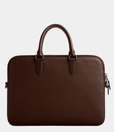 From COACH&#x2C; this brief case features:Slim Brief Pebble leather and refined Calfskin leatherInside snap pocketZip closureFabric liningHandles with 4.25" dropOutside magnetic snap pocketsDetachable strap with 25" drop for shoulder or crossbody wearFits a 16" laptop14.75 (L) x 10.5 (H) x 1 (W)Imported. Brown Textured Leather Briefcase For Work, Coach Brown Pebbled Leather Bag, Brown Pebbled Leather Coach Bag, Coach Leather Briefcase For Work, Luxury Coach Briefcase For Work, Classic Coach Bags In Textured Leather, Classic Coach Textured Leather Bag, Classic Coach Bags With Smooth Grain, Classic Coach Bags With Textured Leather