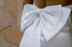 On par for the 2024 and 2025 brides! Bows are the IT accessory so what better way to add it it any and every bridal outfit you have! This double bow will surely be the center of attention. Easily pin it to a dress or bikini for your bachelorette. Personalization is beautifully embroidered for that lasting touch. Elegant Fitted Wedding Dress For Bridal Shower, Elegant Bridal Accessories With Satin Bow, Elegant Satin Bridal Accessories For Wedding, Elegant Wedding Dress For Bridal Shower, Elegant White Wedding Dress For Bride, Fitted Satin Bow For Wedding, Elegant White Satin Bow, Chic Wedding Bow With Tie Back, Chic White Wedding Bow