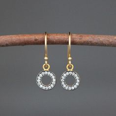 "Sparkling White Topaz stones are pave set in rhodium plated gold vermeil circles. These dangle from gold vermeil balled earwires. The backs of the charms are pierced to allow light to shine through so the stones can shimmer. Save these shimmering earrings for a special occasion (a wedding perhaps?) or wear them everyday to brighten up your work week! White Topaz charms: 9x12mm Total length of earrings: 1\" All gold is 18k gold vermeil. As the owner, maker, designer, and curator of this shop, I Diamond White Small Hoop Earrings With Halo Design, Diamond White Halo Design Small Hoop Earrings, Gold Diamond Halo Earrings In Sterling Silver, Gold Diamond Earrings With Halo Design In Sterling Silver, Gold Sterling Silver Cluster Earrings With Halo Design, Yellow Gold Round Crystal Earrings For Anniversary, Yellow Gold Circle Earrings For Anniversary, Yellow Gold Circular Anniversary Earrings, Small Hoop Diamond Pierced Earrings