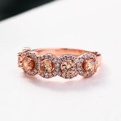 Rose Gold Halo Five Stone Champagne Stone RingEmbedding diamonds by handcraft. Exquisite design made perfect for an engagement ring, wedding ring, promise ring, bridal ring set, anniversary ring, couples ring, and more. Wonderful gifts for birthdays, Mother's Day, Valentine's Day, Thanksgiving, Christmas, and all other occasions.Our mission is to create premium stones that shine like a natural diamond. Gemstone types, shapes, colors, and cuts were carefully designed and handcrafted to perfection Anniversary Rings For Her, Couples Ring, Rose Gold Halo, Diamond Anniversary Rings, Gold Halo, Bridal Ring Set, Champagne Diamond, Ring Promise, Couple Rings