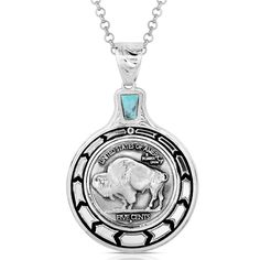 Buffalo Plains Necklace - Made in the USA! Please allow up to 2 weeks to ship Elevate your style with the Buffalo Plains Necklace. This necklace features a unique Buffalo nickel pendant. A detailed Buffalo nickel coin sits in the center of the design. The edge of the pendant features a silver tone chevron pattern contrasted by deep black. A turquoise stone sits just above the pendant, adding a touch of color. This necklace has a 28 inch chain. Stone color may vary. Dimensions Width 1.53 Height 2.49 Length 28 Materials Silver over brass. Crafted turquoise. Paint. Montana Armor to prevent tarnish. Rhodium over brass chain. Symbolic Coin-shaped Jewelry With Large Pendant, Symbolic Large Coin Pendant Jewelry, Symbolic Jewelry With Large Coin Pendant, Symbolic Medallion Coin Pendant Jewelry, Symbolic Coin-shaped Collectible Jewelry, Sterling Silver Etched Coin Jewelry, Symbolic Medallion Necklace With Coin Pendant, Symbolic Collectible Coin Jewelry, Etched Sterling Silver Coin Jewelry