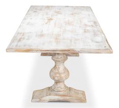 an old wooden table with white paint on the top and base, against a white background