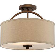 a light fixture with a beige shade on the drum and an iron frame around it