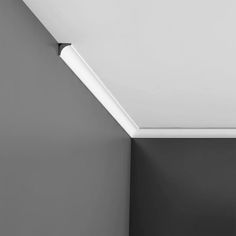 a black and white photo of a ceiling light in a room with no one on it