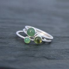 Spring Green Stacking Rings Set of Three Sterling Silver | Etsy Green Sterling Silver Stackable Jewelry, Green Gemstone Stackable Rings In Sterling Silver, Green Sterling Silver Stackable Emerald Ring, Green Sterling Silver Stackable Rings For May Birthstone, Chrysoprase Gemstone Ring For May Birthstone, Silver Chrysoprase Round Rings, Handmade Green Moonstone Ring In Sterling Silver, Green Sterling Silver Moonstone Ring Gift, Adjustable Green Moonstone Ring In Sterling Silver