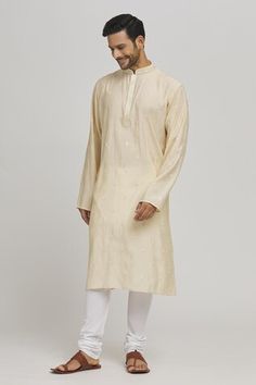 Off white kurta with thread embroidered geometric butti patterns and sequin work embellishments. Comes with churidar. - Aza Fashions Fitted White Cotton Silk Kurta, White Fitted Cotton Silk Kurta, Ceremonial Chikankari Traditional Wear In Cotton Silk, White Cotton Silk Churidar With Long Sleeves, White Fitted Cotton Silk Traditional Wear, Embroidered Off White Cotton Silk Traditional Wear, Fitted White Cotton Silk Sherwani, White Cotton Silk Churidar With Pallu, Traditional Off White Cotton Silk Kurta