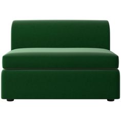 a green couch sitting on top of a white floor