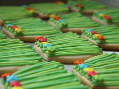 decorated cookies with green icing and colorful decorations