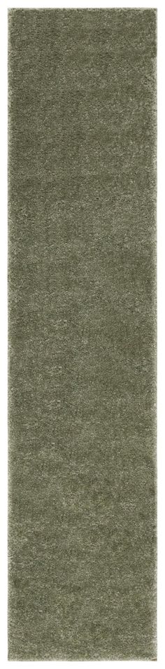 an area rug that is made up of various shades of grey and green, with a white background