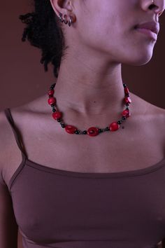 This handmade Necklace is strung on silk which gives it both strength and flexibility. The red beads are hand-carved coral. Adjustable Red Beaded Necklace With Gemstone Beads, Unique Red Coral Beaded Necklaces With Large Beads, Artisan Red Beaded Necklaces With Polished Beads, Handmade Red Beaded Necklaces With Oval Beads, Unique Red Coral Beaded Necklaces With Round Beads, Red Coral Necklaces With Large Beads As Gift, Red Coral Beaded Necklaces With Large Beads, Red Coral Beaded Necklaces, Unique Red Beaded Necklaces With Gemstone Beads