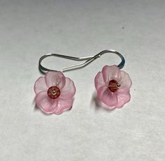 Nature inspired light pink sweet pansy flower earrings with yellow Swarovski crystal center and silver plated surgical steel hammered French hook ear wires.  Earrings measure about 1 inch in length. Questions? please message me. Thanks for visiting my shop. View all Southpass Beads and Fibers beads, yarn and supplies here: http://www.etsy.com/shop/southpassbeads Thanks for visiting my shop! Please come back again! Nature Inspired Lighting, Pansy Flower, Vintage Style Earrings, Pansies Flowers, Flower Vintage, Please Come Back, Style Earrings, Pansies, Flower Earrings