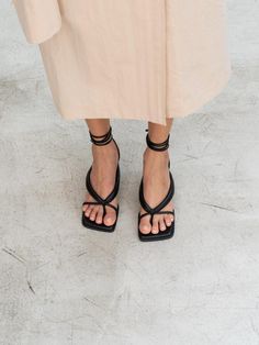 - Square toe- Self-tie strappy sandal- Bold flip flop strap- French mid heelMeasurements- Heel: 2.3- Size: KR225(US5.5)-KR250(US8)- This item is based on the KR shoe size. Please refer to the size chart.- This item runs true to size. For wide feet, please order half size larger than your normal size.Composition & Care- Upper: Sheep leather- Midsole: Sheep Leather- Insole: Synthetic LeatherDesigner- Made in Korea- by CHIELEI- Style#: 300905777 Summer Strappy Lace-up Sandals With Heel Loop, Chic Sandals With Toe Loop And Strap, Chic Toe Loop Sandals With Strap, Summer T-strap Toe Loop Sandals With Heel Strap, Summer Toe Loop T-strap Sandals, Chic Sandals With Heel Strap And Toe Loop, Chic T-strap Sandals With Heel Strap, Chic Sandals With Heel Strap And Toe Post, Chic Ankle Strap Toe Ring Sandals For Spring