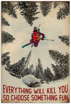 a man flying through the air while riding skis on top of snow covered ground