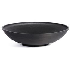 a black bowl sitting on top of a white table