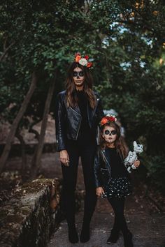 mother and daughter wearing day of the dead makeup for their halloween photo shoot in los angeles