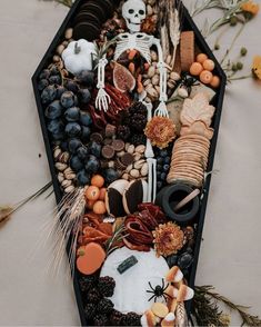 a boat filled with food and decorations on top of a table