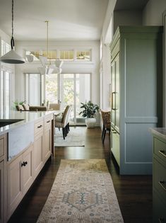 the kitchen is clean and ready to be used as a living room or dining area