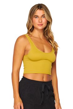 This ribbed crop top features a unique design that is both stylish and comfortable. The ribbed texture offers a form-fitting silhouette while the crop design allows for versatile styling options. Elevate your wardrobe with this must-have piece. Trendy Seamless Crop Top For Loungewear, Versatile Seamless Crop Top For Loungewear, Ribbed Fitted Crop Top, Versatile Ribbed Crop Top, Solid Ribbed Cropped Top, Trendy Crop Top Tank For Loungewear, Ribbed Crop Top Tank Top For Loungewear, Ribbed Crop Top For Loungewear, Trendy Cropped Seamless Top