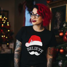 If you are looking for the perfect Believe Christmas Shirt, spooky christmas tee, goth christmas shirt, family christmas tee, dark aesthetic shirt, santa shirt, Believe Shirt then look no further! ►Style Unisex Softstyle Gildan 64000 T-shirt Standard length and fabric non constrictive ► Material  Made of durable cotton fabric and has a double-stitched bottom hem and sleeves.  Solid colors are 100% ring-spun cotton Sport Grey is 90% ring-spun cotton, 10% polyester Dark Heather is 65% polyester, 3 Black Winter Holiday T-shirt, Black Casual T-shirt For Festive Occasions, Casual Black T-shirt For Festive Occasions, Black Christmas T-shirt As Gift, Christmas Black Graphic Tee T-shirt, Black Graphic Tee For Christmas, Holiday Black T-shirt With Letter Print, Black Graphic Print T-shirt For Holiday, Black Christmas T-shirt With Short Sleeves