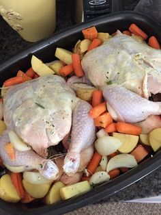 chicken, potatoes and carrots in a roasting pan