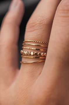 This stacking ring set is so textural and cute! Either wear them all at once or mix them in with your favorite rings for extra width and sparkle! Each ring is individually cut, soldered and polished for a beautiful hand-crafted, high-quality ring. This listing is for FIVE rings.This set is made out of 14K GOLD FILL, ROSE GOLD FILL or STERLING SILVER metal.- 1x Mini Bead Ring (has slightly hammered finish)- 2x Medium Thick Hammered Rings - 2x Medium Thick Smooth Rings This new version of the Bead Gold Stacker Rings, Rose Gold Ring Stacks, Copper Rings Women, Gold Rings Stack, Gold Rings Aesthetic Simple, Gold Ring Stacking Ideas, Gold And Silver Rings Mixed On Hand, Rings For Chubby Fingers, Mixed Metals Rings