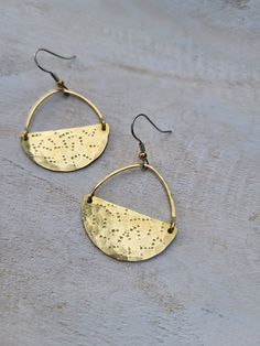 Unique, stamped pair. For fans of all-things-different ;) Made of raw brass. Surgical stainless steel hooks for sensitive ears. 1 1/4 inches long measuring from the bottom of the hook. *Please, remember that all metals, brass included, get darker over time. Cleaning your earrings with the mix of lemon juice and baking soda will make them shine again. Meanwhile, follow us on IG @boho.designs.by.katya and/or Fb: Boho Designs by Katya Everyday Bronze Brass Earrings, Everyday Cadmium-free Brass Earrings, Stamped Metal Earrings For Gifts, Adjustable Stamped Dangle Earrings, Lemon Juice And Baking Soda, Brass Earrings Handmade, Hammered Brass, Milwaukee Wi, Earrings Unique