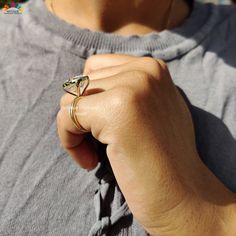 a close up of a person wearing a ring