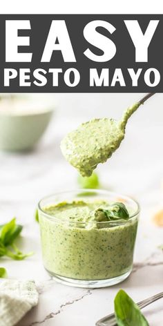 a spoon full of pesto sauce with the title overlay reading easy pesto mayo