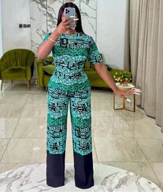 This gorgeous pant set is suitable for every occasion. It's made with African Ankara, All items are made from very high quality 100% cotton african print and this item is not an exception. If you would rather provide a custom size, please leave your bust, waist, hip, thigh circumference, biceps and height measurements in the note to seller section when you order. However, if you would like more fabric options, kindly let me know. Thank you. Kindly contact me if additional information is required Ankara Pant Set Two Pieces, Styles For Jumpsuit, Casual Two-piece Set With Wide-leg Pants, Casual Matching Set With Wide-leg Pants, Ankara Trousers Pants High Waist, Elegant Green Short Sleeve Sets, 2piece Outfits Pants Ankara, Fitted Matching Set For Workwear, Chic Two-piece Short Sleeve Set